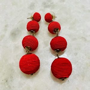 Red tiered statement earrings